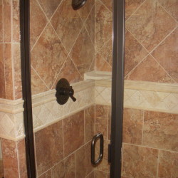 custom tiled shower, glass shower doors