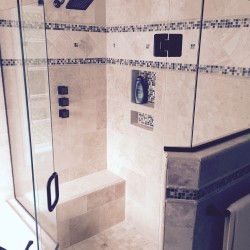 Large walk in shower with custom seat and nice