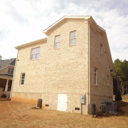 Rear view of custom two-story garage