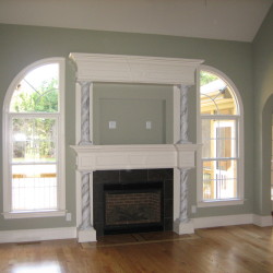 Family Room with arch windows and custom fireplace