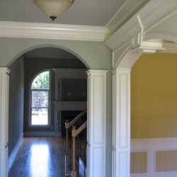 Foyer with arches and detailed trim work