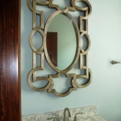 Guest bathroom with decorative mirror