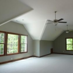 Large bonus room with ceiling fan and lots of winders