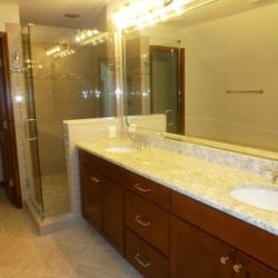 Guest bathroom with large vanity and glass shower