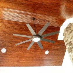 Bead board ceiling wtih large ceiling fan in screened in pourch