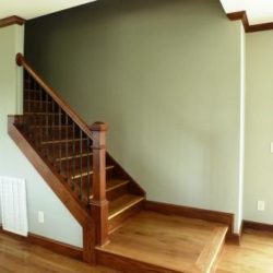 Stair case with custom wooden railing